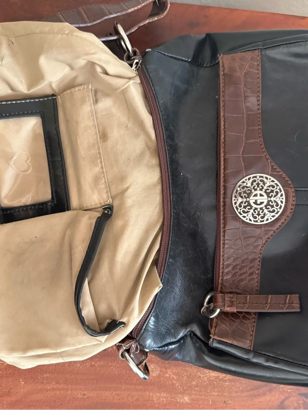 Women’s Brown and Black Shoulder Bag with Decorative Emblem